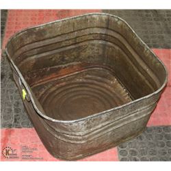 ANTIQUE METAL TUB WITH SIDE HANDLES.