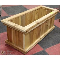 50"X12"X10"H CEDAR STAINED PLANTER.