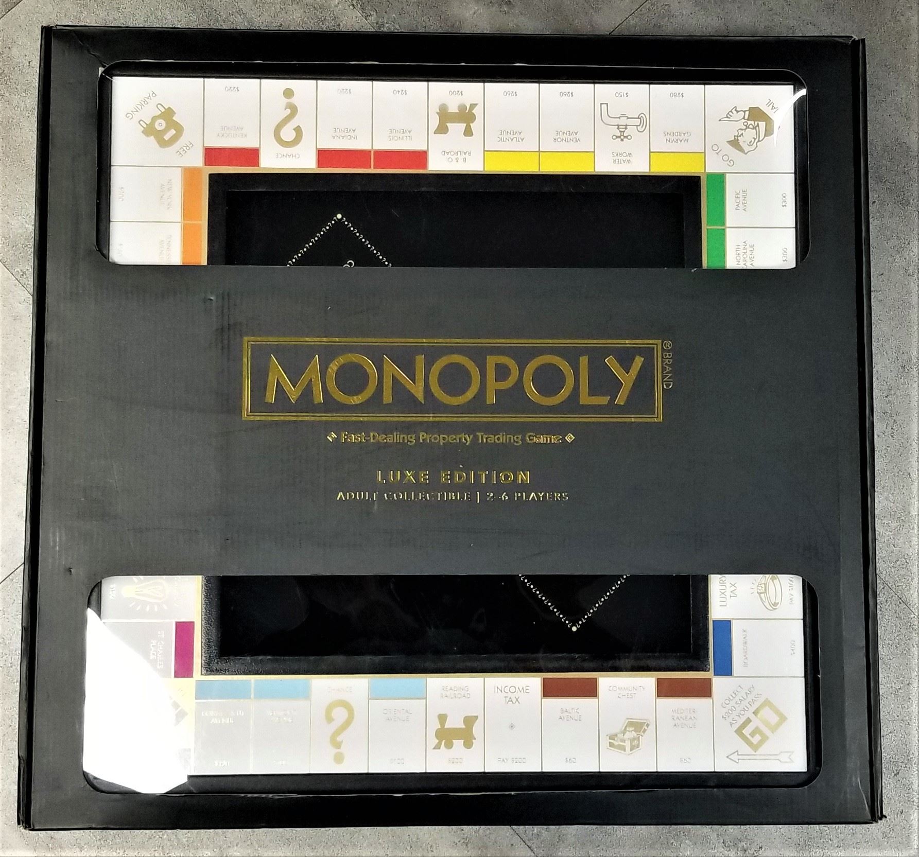 DELUXE EDITION MONOPOLY FAST DEALING PROPERTY TRADING GAME BLACK AND GOLD