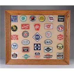 FRAMED LOT OF TIN RAILROAD INSIGNIAS