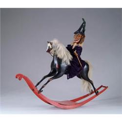 CLOCKWORK ROCKING HORSE WITH MONKEY ASTRIDE