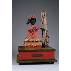 CONTEMPORARY AUTOMATON OF A BLACK MAGICIAN LEVITATING A WHITE CHILD