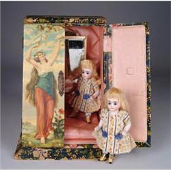 TWIN 5-1/2in. ALL BISQUE SISTERS WITH YELLOW BOOTS CONTAINED IN DOLL WARDROBE