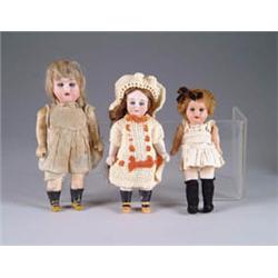 FIVE SMALL DOLLS