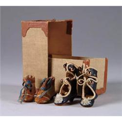 TWO PAIR OF DOLL SHOES ALONG WITH CARDBOARD TRUNK