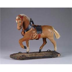 HIDE-COVERED HORSE ON PLATFORM