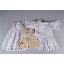 20 PIECES OF ASSORTED DOLL DRESSES