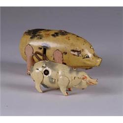 LOT OF 2 TIN MECH. PIGS