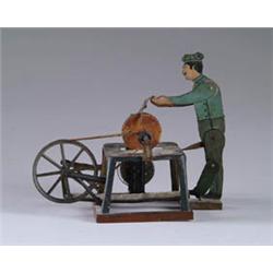 WORKER AT GRINDING WHEEL