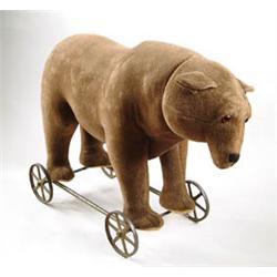 LARGE EARLY STUFFED BEAR ON WHEELS