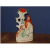 Image 1 : A Staffordshire flatback spill vase surmounted by a figure of Red Riding Hood, H 20cm...