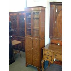 A walnut bookcase, H 182cms W 53cms...