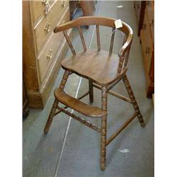 A beech child's high chair, and a Turkish rug....