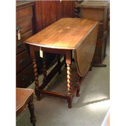 An oak gateleg table, with barleytwist underframe, L 107cms W 153cms...