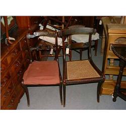 A near-matching pair of Regency mahogany cut brass-inlaid dining chairs...