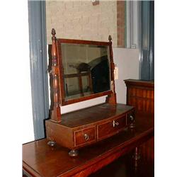 An early 19th century mahogany toilet mirror with three drawers to base, H 51cms W 46cms...