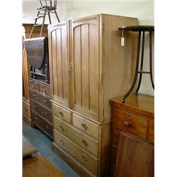 An Edwardian golden oak linen press, (lacking cornice), H 196 cms W 118 cms...