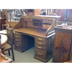 A 1930's oak roll top desk, H 125cms W 138cms...