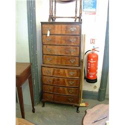 A walnut bow-fronted chest on chest, H 143cms W 62cms...