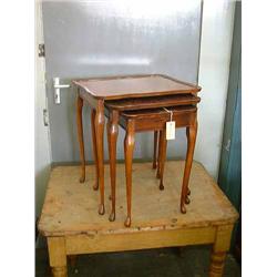 A nest of three mahogany and beech tea tables, H 55cms W 50cms (the largest)...