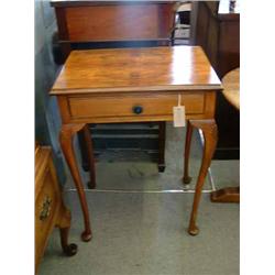A walnut side table, on carved cabriole legs, H 74cms W 54cms...