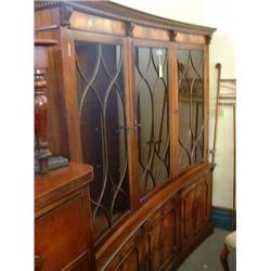 A Georgian style concave-fronted mahogany bookcase, H 182 cms W 180cms...