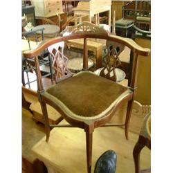 A near pair of Edwardian mahogany corner chairs, with bone and boxwood floral decoration....