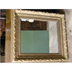 A gilt-framed mirror, 89cms x 79.5cms....