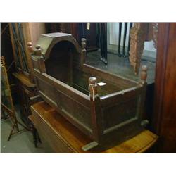 A 19th century oak panelled rocking cradle, L 91.5cms W 41cms...
