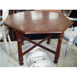 A walnut centre table, H 75cms Dia 121cms...