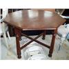Image 1 : A walnut centre table, H 75cms Dia 121cms...
