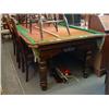 Image 1 : An early 20th century oak-framed snooker table with associated cues and balls, L 226cms D 118cms...