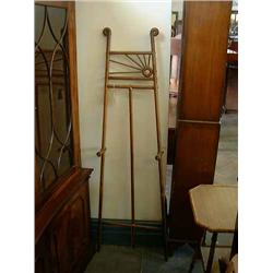 An Art Deco oak artist's easel of stylised radiant design, H 154cms W 41cms...