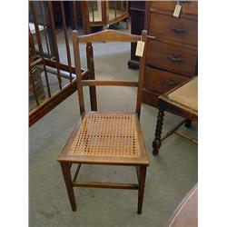 An Edwardian mahogany cane seat chair...