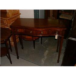 A mahogany serpentine side table fitted two drawers, H 87cms W 100cms...