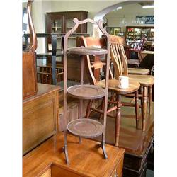 A mahogany folding three-tier cake stand, H 88cms W 28cms...