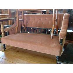 An Edwardian ebonised two-seat settee, L 132cms...