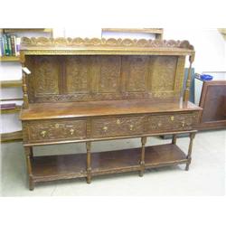 A carved oak dresser, H 152.5cms 193cms...
