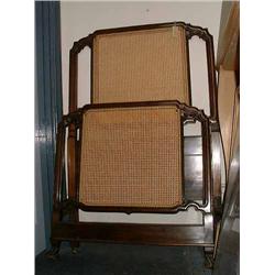 A French mahogany single bed, with shaped, caned panels, on scrolled feet, W 93cms...