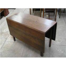 An early 19th century oak drop-leaf dining table, on chamfered legs, L 143cms max W 109.5cms...