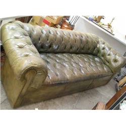A three-seat Chesterfield settee covered in deep-buttoned hide, L 230cm...