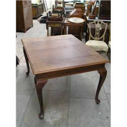 An oak extending dining table, on cabriole legs (with two matched leaves), L 176cms max W 100cms...
