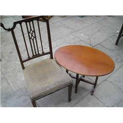 A pair of Edwardian mahogany side chairs, an oak occasional table, a folding table and a caned si...