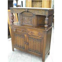 A 17th century style carved oak court cupboard, H 145cms W 119.5cms...
