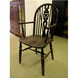 A pair of beech and elm Windsor wheelback armchairs...