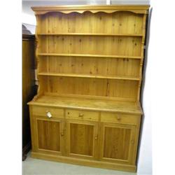 A pine dresser with plate rack, H 213.5cms W 152.5cms...