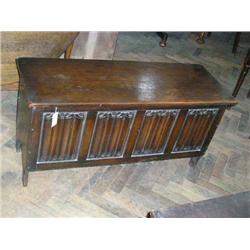 An linenfold-carved blanket chest, H 56cms 110.5cms...