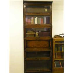 An oak six-section Globe Wernicke style secretaire bookcase, H 230cms W 87cms...