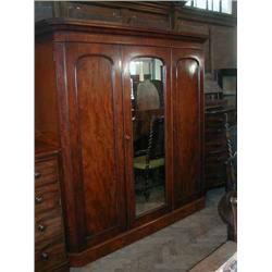 A Victorian mahogany wardrobe with mirrored door, H 122.5cms W 206cms...
