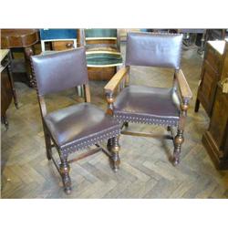 A set of nine Cromwellian style oak dining chairs (two having arms)...